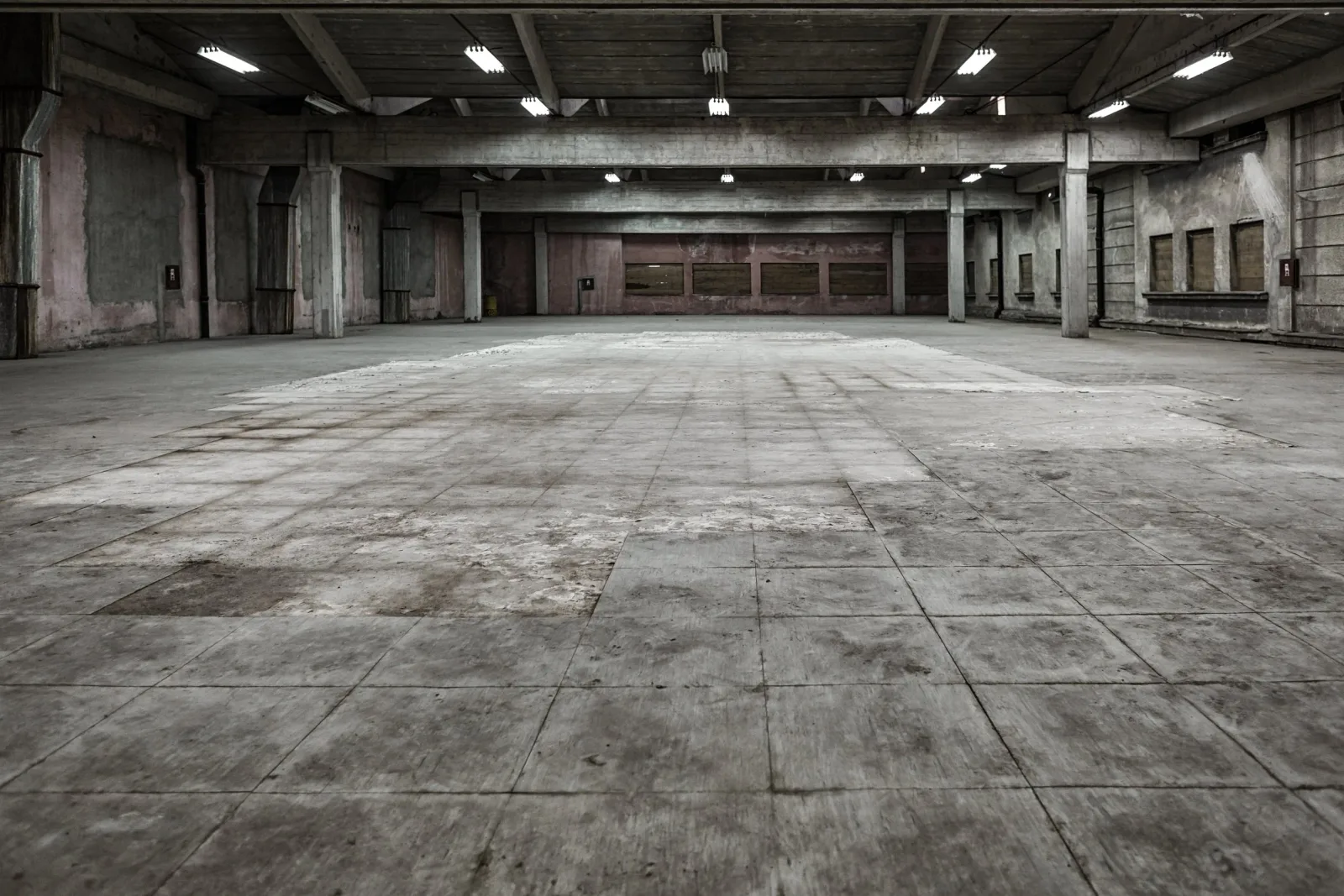 Faux worn concrete printed flooring — produced by IAC, Toronto