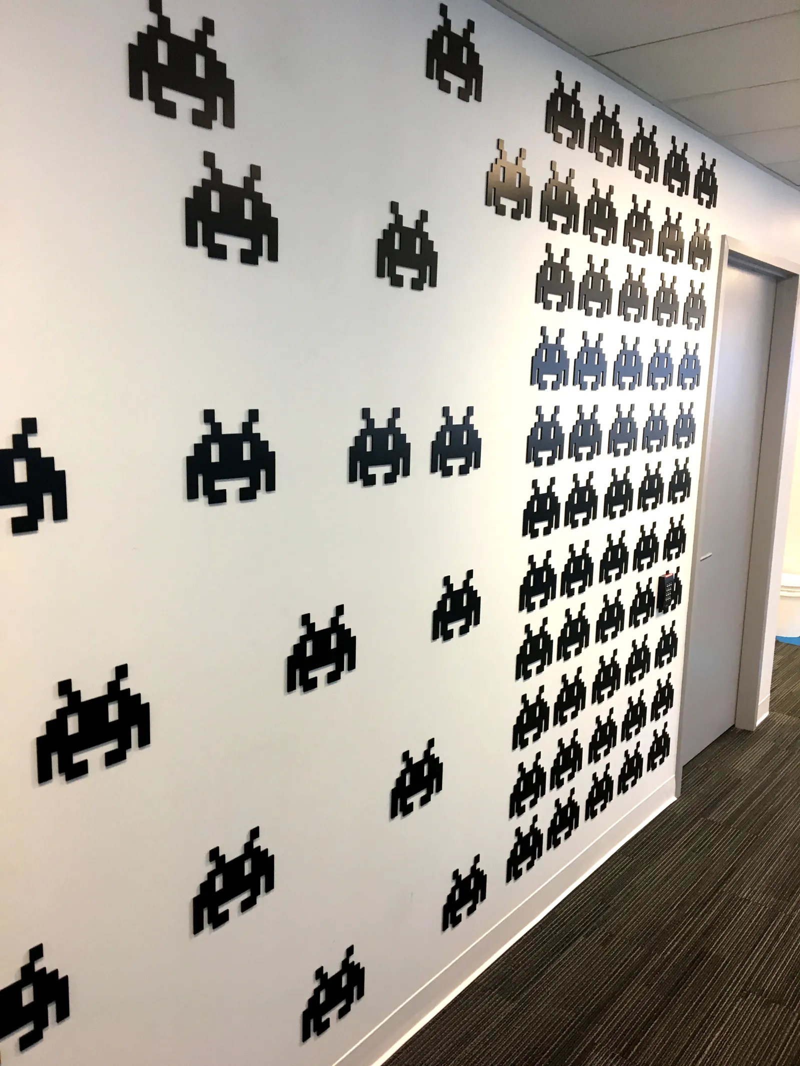 Space Invaders — rigid signage produced and installed by IAC, Toronto